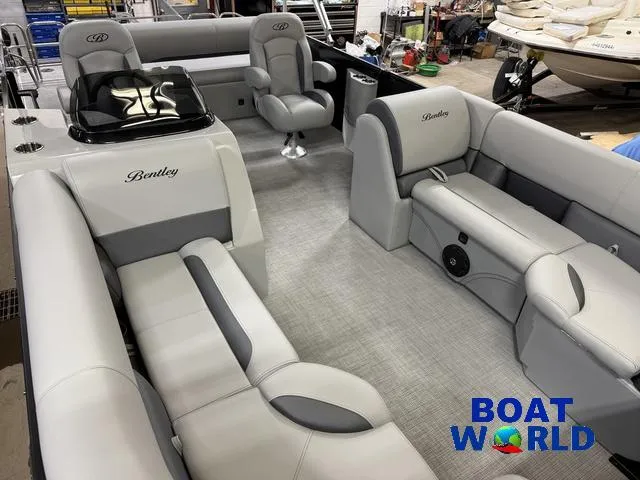 Slide: The Image of 2025 Bentley Pontoons Legacy 220 Swingback interior with luxurious seating, showcased at Boat World. - 32