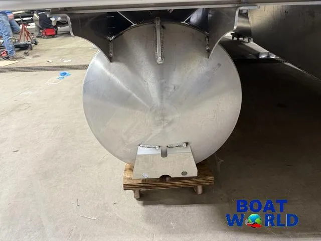 Slide: The Image of 2025 Bentley Pontoons Legacy 220 Swingback underbody view in a workshop setting. - 37