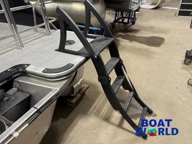 Slide: The Image of Bentley Pontoons Legacy 220 Swingback with ladder, 2025 model, displayed indoors. - 39