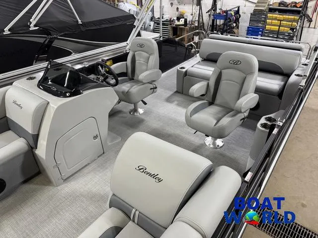Slide: The Image of 2025 Bentley Pontoons Legacy 220 Swingback interior with Honda 4-Stroke EFI engine, showcased at Boat World. - 4