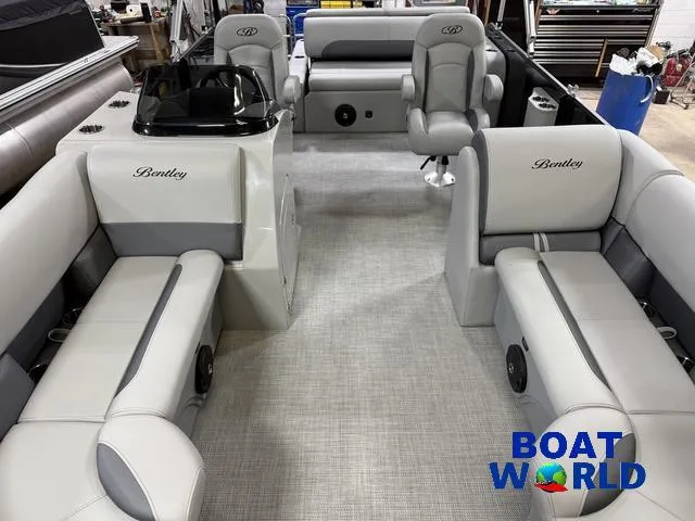 Slide: The Image of 2025 Bentley Pontoons Legacy 220 Swingback interior with luxurious seating, showcased at Boat World. - 7