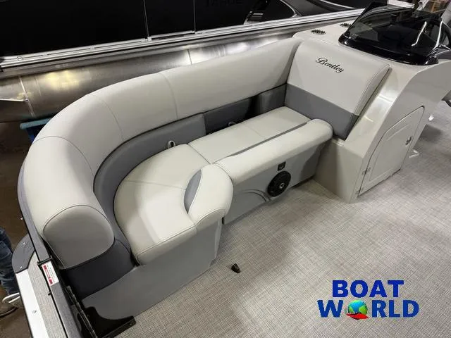 Slide: The Image of 2025 Bentley Pontoons Legacy 220 Swingback interior with plush seating, showcased at Boat World. - 8