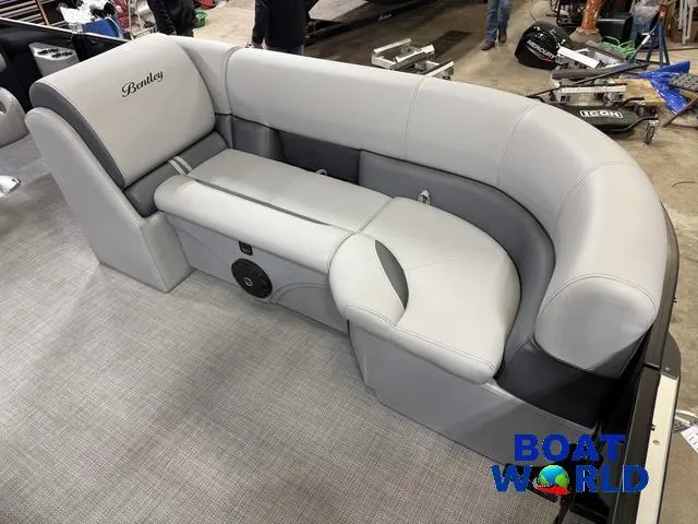 Slide: The Image of 2025 Bentley Pontoons Legacy 220 Swingback interior seating, featuring luxurious gray upholstery. - 9