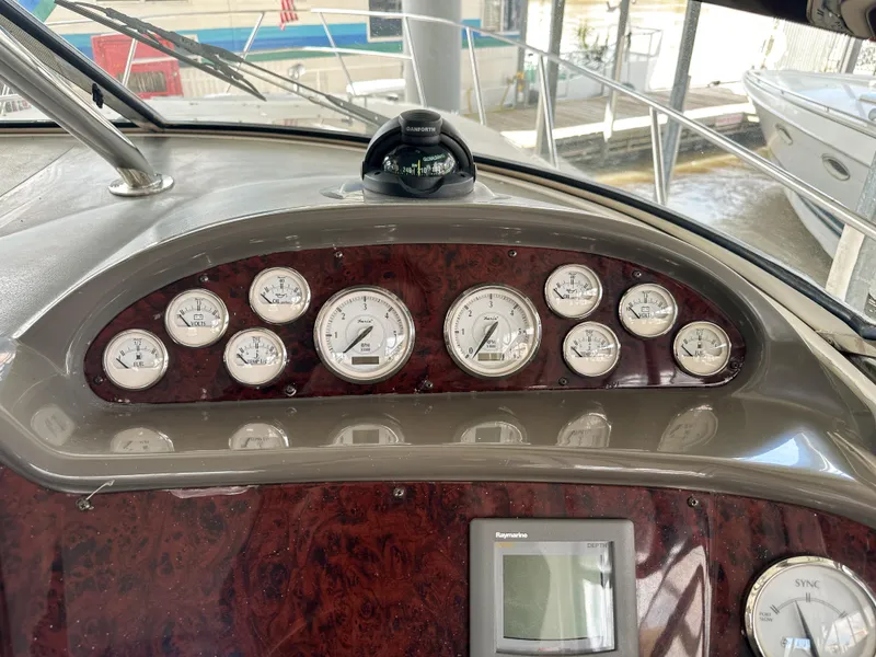 Slide: The Image of Dashboard of 2007 Regal Commodore 3760 IO with gauges and compass. - 12