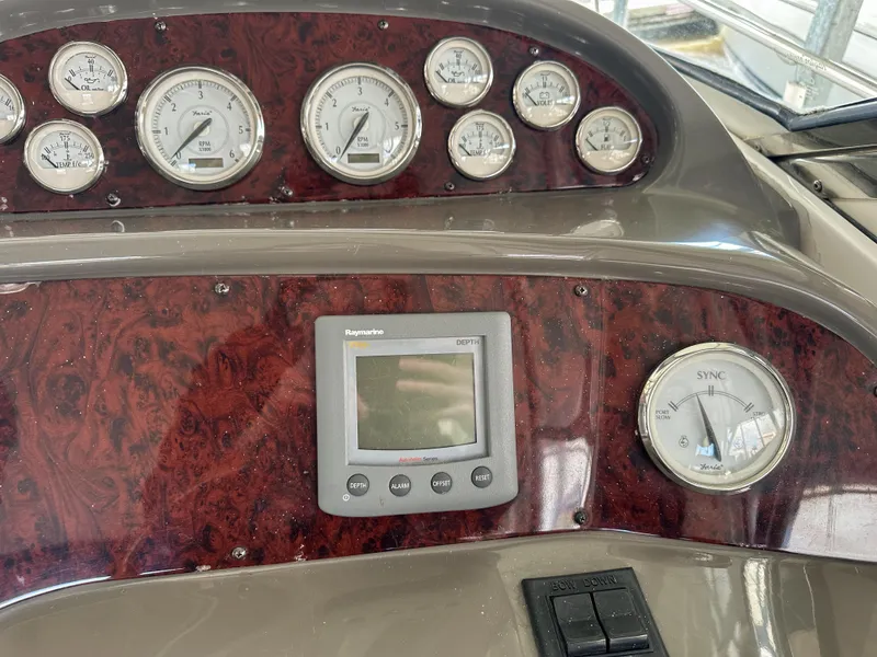 Slide: The Image of Dashboard of 2007 Regal Commodore 3760 IO with gauges and navigation display. - 14
