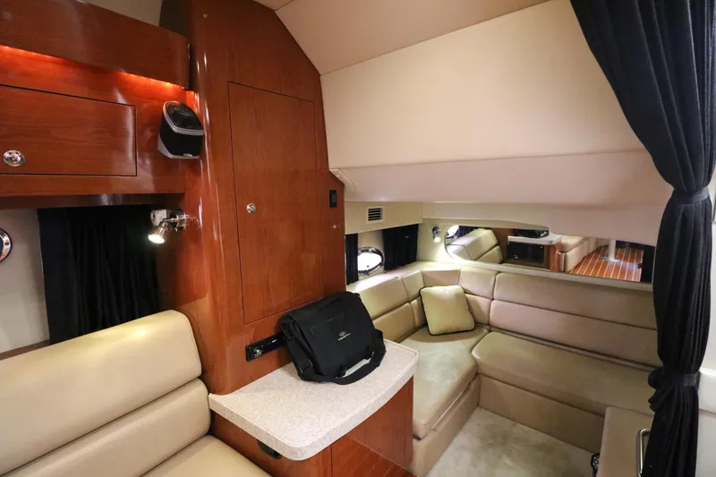 Slide: The Image of Interior of 2007 Regal Commodore 3760 IO yacht with beige seating and wooden cabinetry. - 17