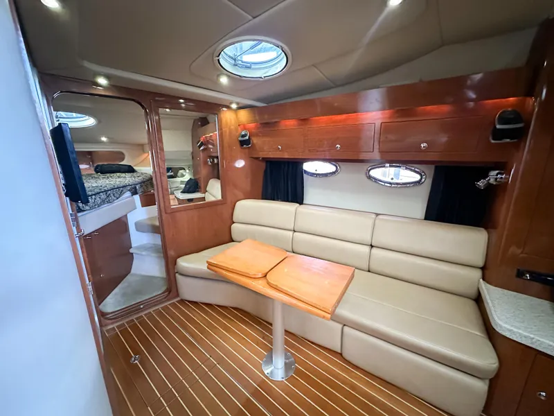 Slide: The Image of Luxurious interior of 2007 Regal Commodore 3760 IO yacht with leather seating and wooden accents. - 20
