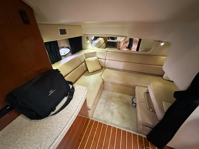 Slide: The Image of 2007 Regal Commodore 3760 IO interior with beige seating and wooden flooring. - 22