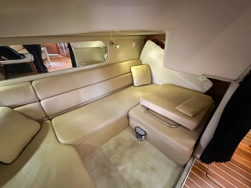 Slide: The Image of 2007 Regal Commodore 3760 IO interior with beige seating and wooden flooring. - 23