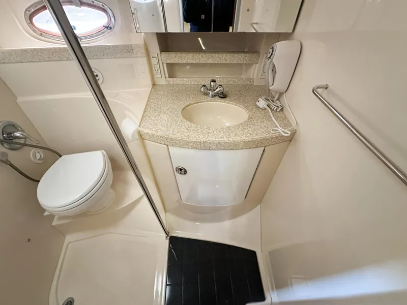 Slide: The Image of 2007 Regal Commodore 3760 IO bathroom with sink, toilet, and shower. - 26