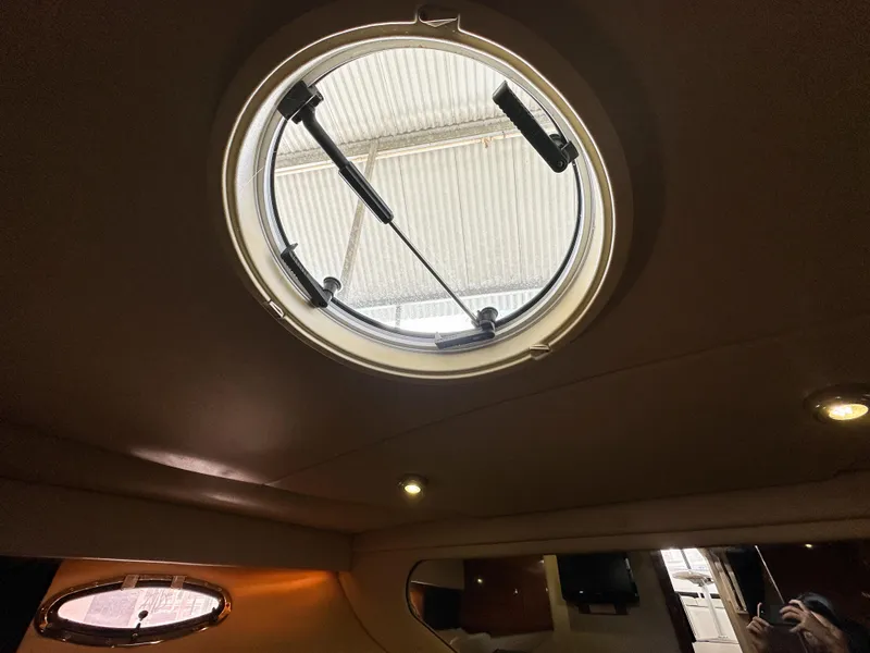 Slide: The Image of Circular hatch inside 2007 Regal Commodore 3760 IO boat cabin, with natural light. - 35