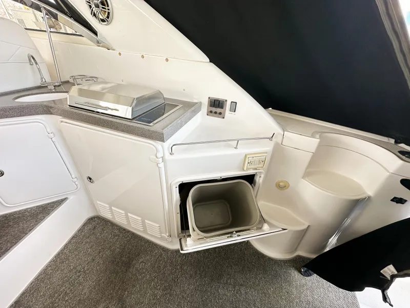 Slide: The Image of 2007 Regal Commodore 3760 IO boat interior with kitchenette and storage. - 38