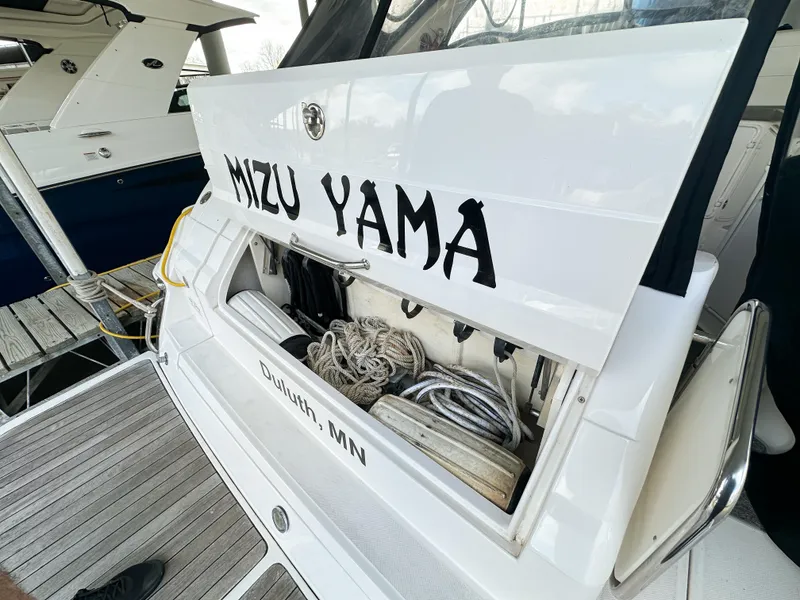 Slide: The Image of 2007 Regal Commodore 3760 IO boat with storage compartment open, docked in Duluth, MN. - 4