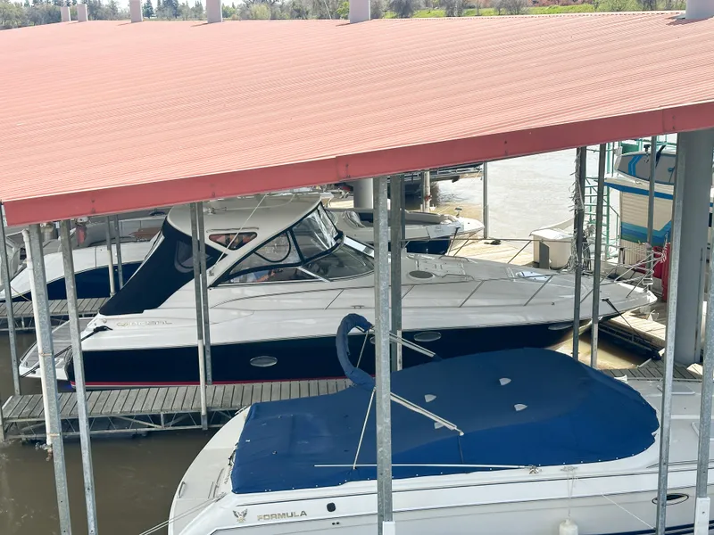 Slide: The Image of 2007 Regal Commodore 3760 IO docked under a covered marina. - 41