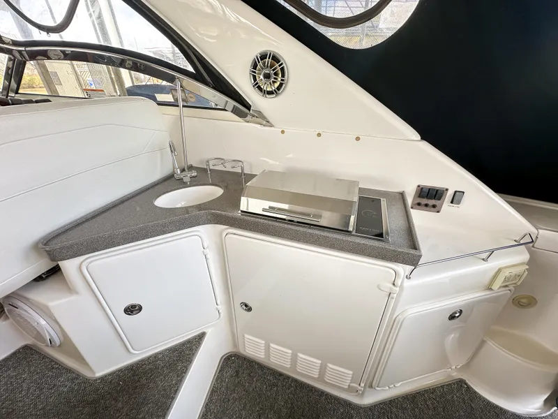 Slide: The Image of 2007 Regal Commodore 3760 IO yacht interior with kitchenette and modern amenities. - 6