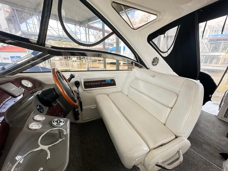 Slide: The Image of 2007 Regal Commodore 3760 IO boat interior with white seating and steering wheel. - 9