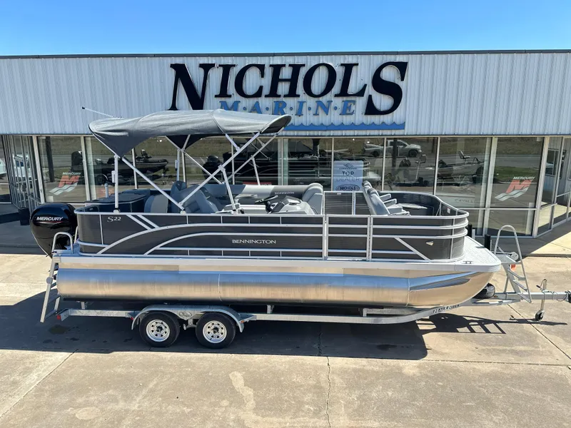 Slide: The Image of 2025 Bennington 22 SF pontoon boat at Nichols Marine dealership. - 1