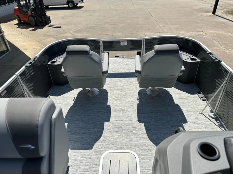 Slide: The Image of 2025 Bennington 22 SF boat interior with two swivel seats and spacious deck. - 6