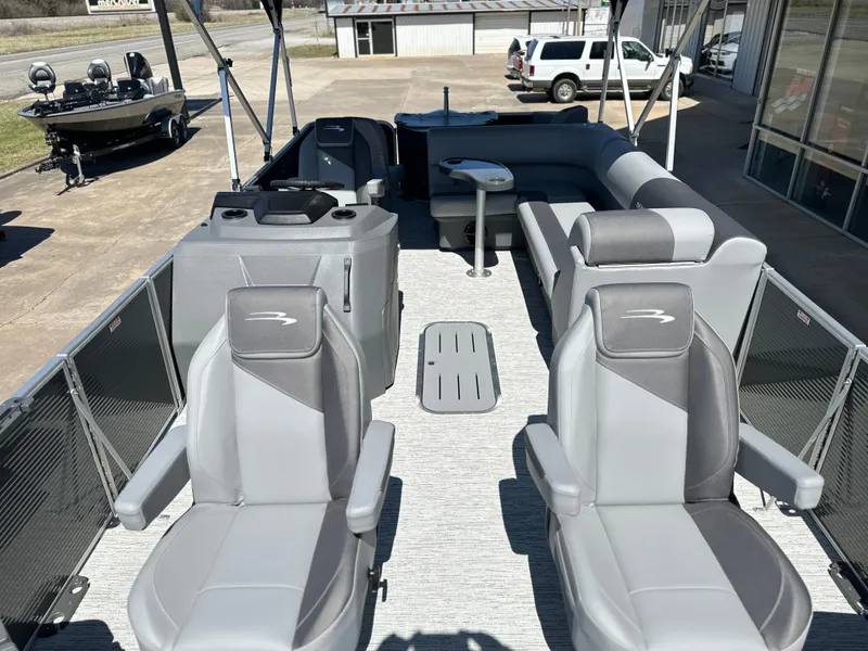 Slide: The Image of 2025 Bennington 22 SF pontoon boat with gray seating and spacious deck layout. - 7