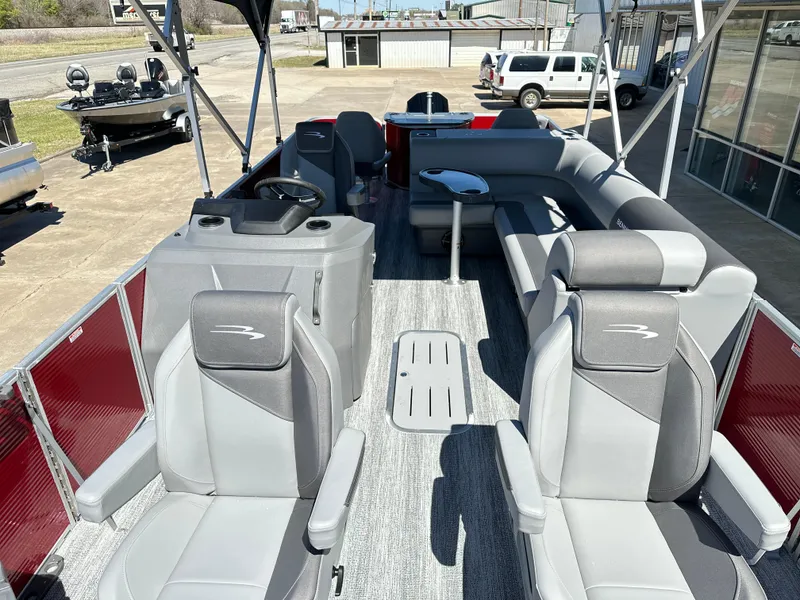 Slide: The Image of 2025 Bennington 23 SF pontoon boat with spacious seating and modern design. - 7