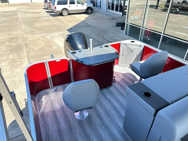Slide: The Image of 2025 Bennington 23 SF pontoon boat with red accents and modern seating. - 8