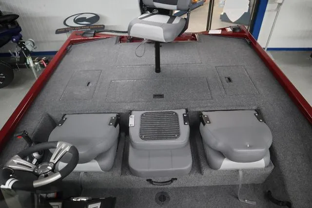 Slide: The Image of 2025 Lowe Stinger 175 C boat interior with seating and steering wheel. - 9