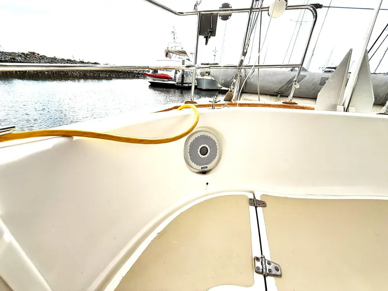 Slide: The Image of Cabo Rico Pearl Edition Anniversary Special 2000 yacht cockpit with speaker and marina view. - 12