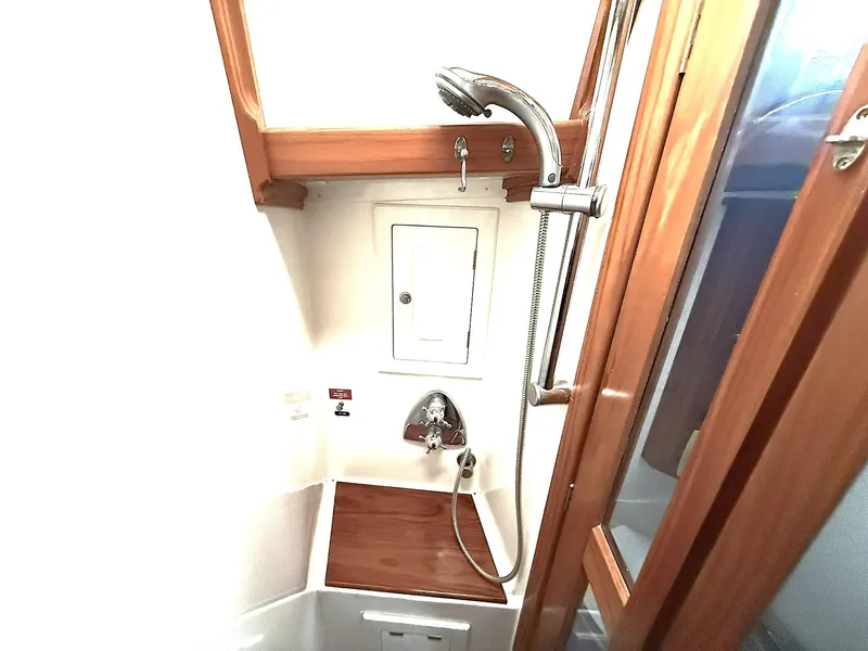 Slide: The Image of Cabo Rico 2000 Pearl Edition yacht shower with wooden accents and modern fixtures. - 25
