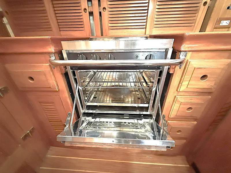 Slide: The Image of Stainless steel oven in a 2000 Cabo Rico Pearl Edition yacht kitchen. - 30
