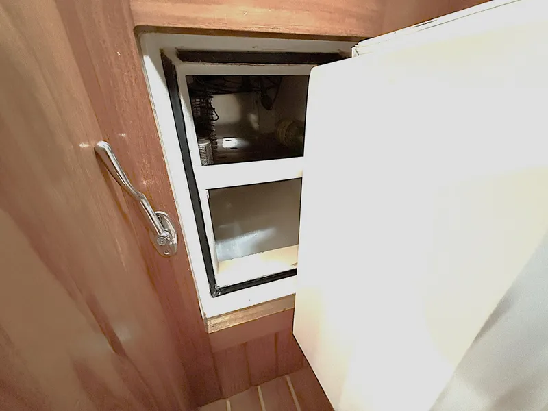 Slide: The Image of Cabo Rico Pearl Edition 2000 yacht interior with open storage compartment. - 32