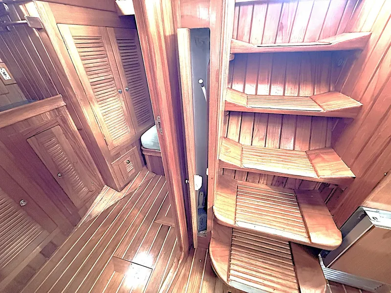 Slide: The Image of Interior of 2000 Cabo Rico Pearl Edition yacht with wooden stairs and cabinetry. - 35