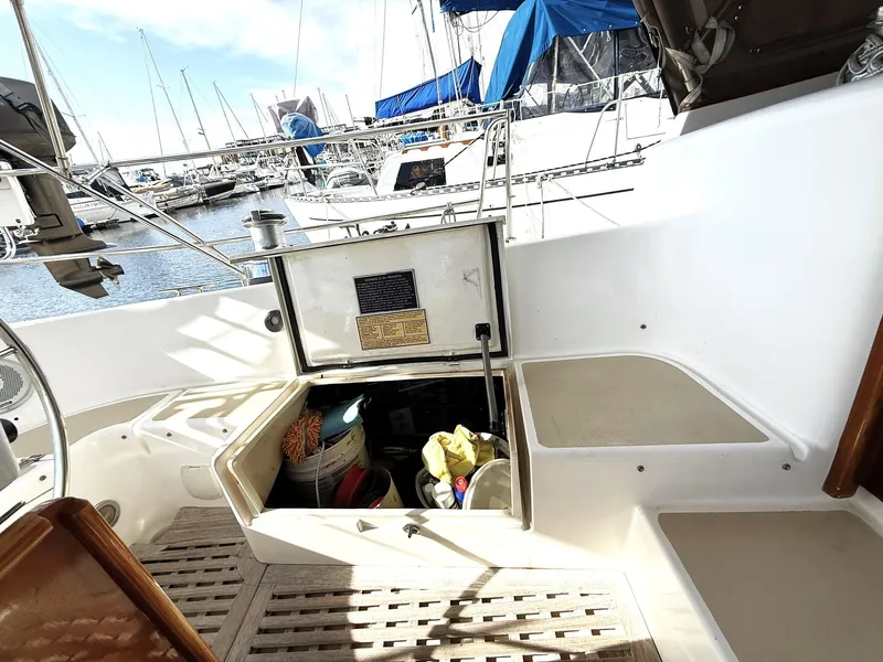 Slide: The Image of Cabo Rico Pearl Edition 2000 yacht cockpit with open storage, docked at marina. - 36