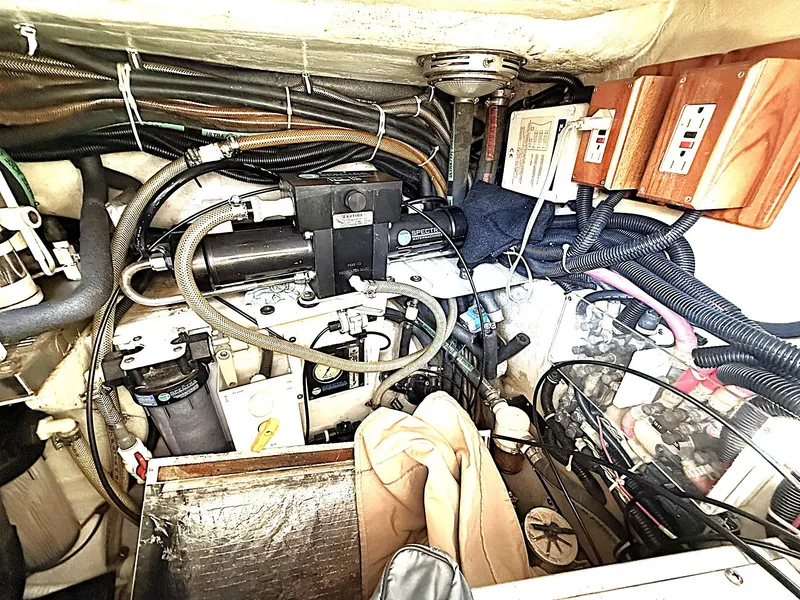 Slide: The Image of Engine room of 2000 Cabo Rico Pearl Edition Anniversary Special yacht, showcasing complex wiring and components. - 37