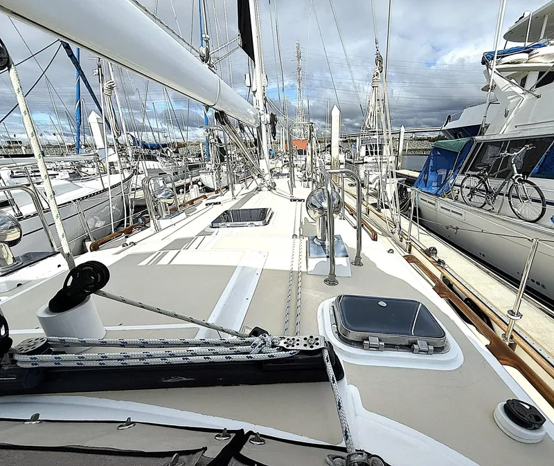 Slide: The Image of Sailboat deck view of 2000 Cabo Rico Pearl Edition Anniversary Special, docked in a marina. - 39