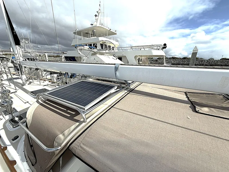 Slide: The Image of Cabo Rico Pearl Edition Anniversary Special 2000 yacht with solar panel on deck, docked under cloudy sky. - 46