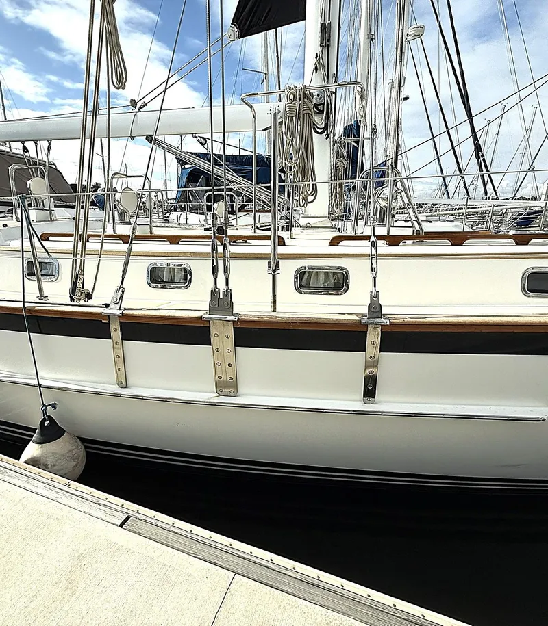 Slide: The Image of 2000 Cabo Rico Pearl Edition Anniversary Special sailboat docked at marina. - 8