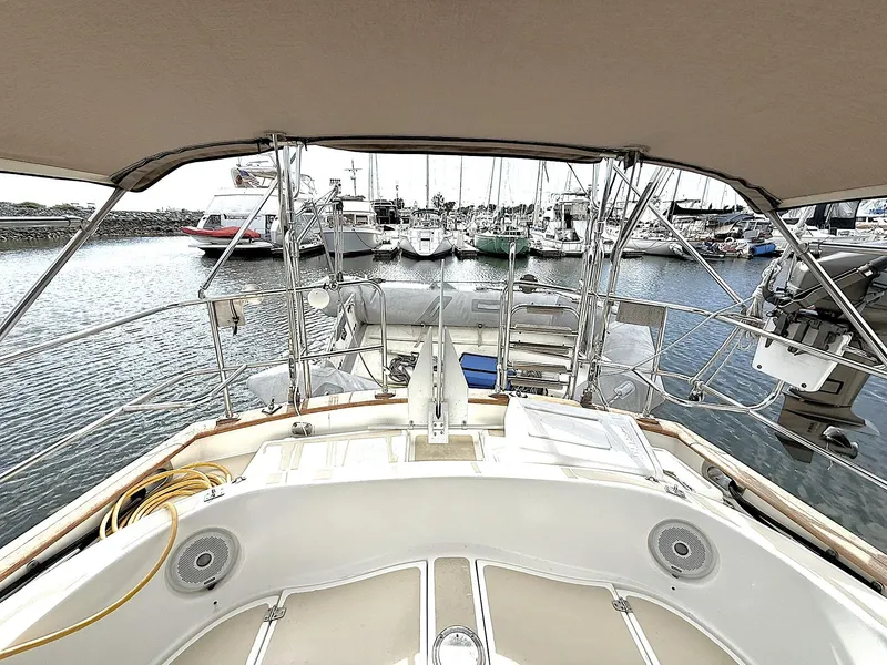 Slide: The Image of Cabo Rico Pearl Edition Anniversary Special yacht, 2000 model, docked in a marina. - 9