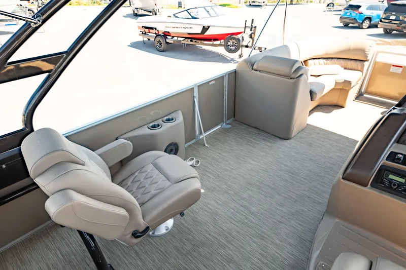 Slide: The Image of Interior of 2022 Bennington LX 24 Swingback pontoon boat with plush seating and modern design. - 3