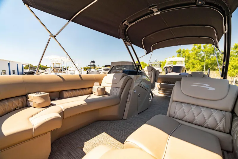 Slide: The Image of Luxurious interior of 2022 Bennington LX 24 Swingback pontoon boat with plush seating. - 41