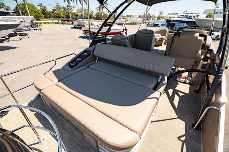 Slide: The Image of 2022 Bennington LX 24 Swingback boat with spacious seating and modern design. - 5