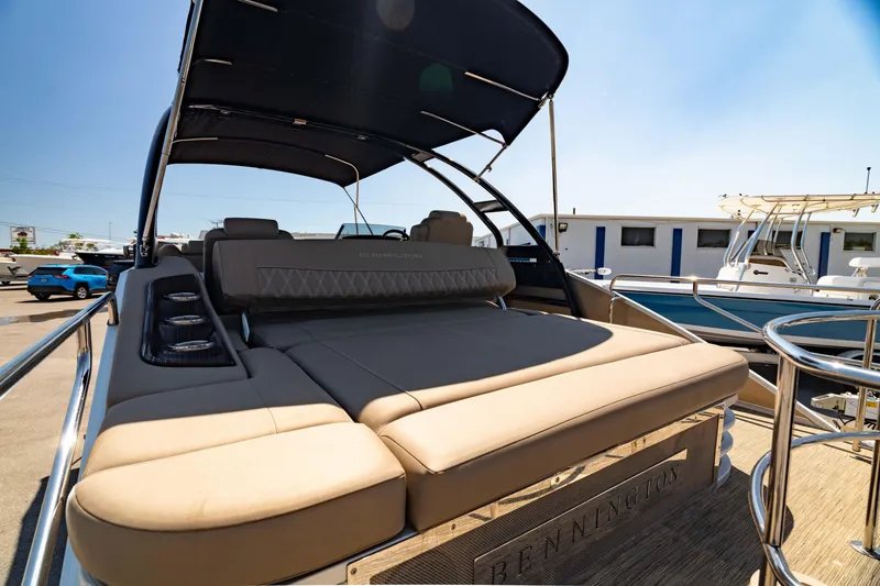 Slide: The Image of 2022 Bennington LX 24 Swingback pontoon boat with luxurious seating and sleek design. - 7