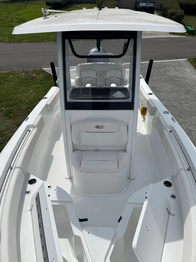 Slide: The Image of 2019 Sea Hunt 235 SE boat with spacious deck and modern console design. - 10