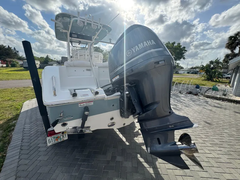Slide: The Image of 2019 Sea Hunt 235 SE boat with Yamaha outboard motor on a sunny day. - 19