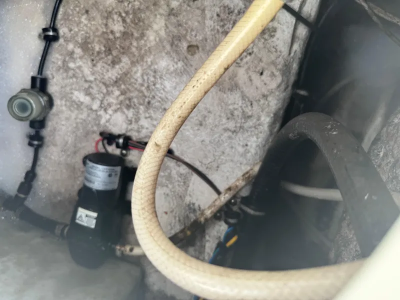 Slide: The Image of 2019 Sea Hunt 235 SE boat interior showing hoses and pump components. - 30