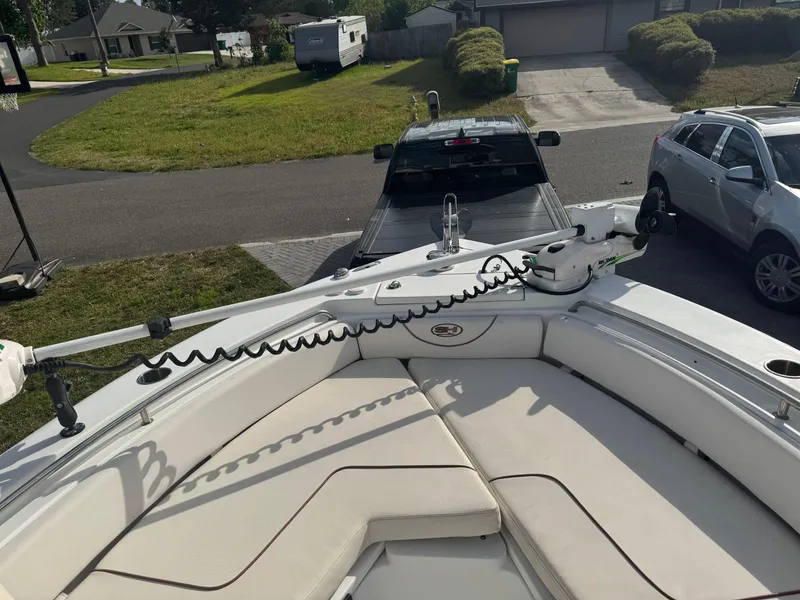Slide: The Image of 2019 Sea Hunt 235 SE boat on trailer, parked in residential driveway. - 36
