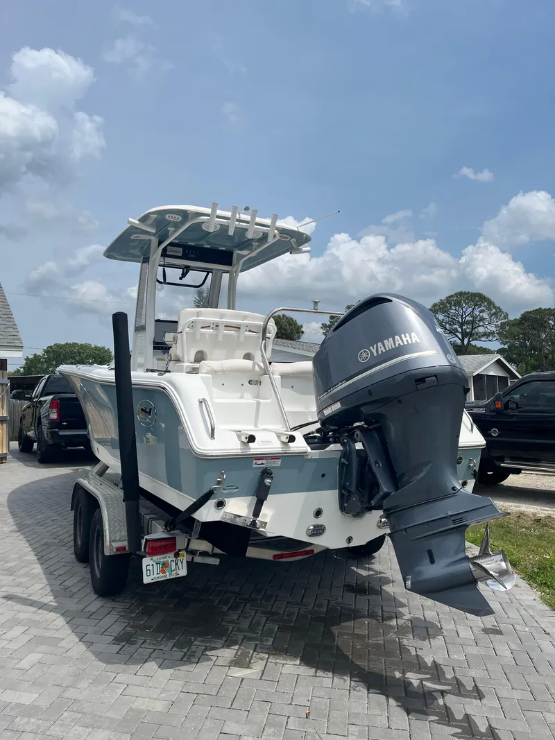 Slide: The Image of 2019 Sea Hunt 235 SE boat with Yamaha outboard motor on a trailer. - 4