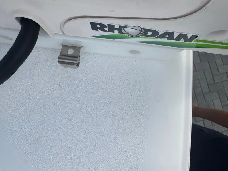 Slide: The Image of Close-up of 2019 Sea Hunt 235 SE boat with Rhodan logo and textured surface. - 43