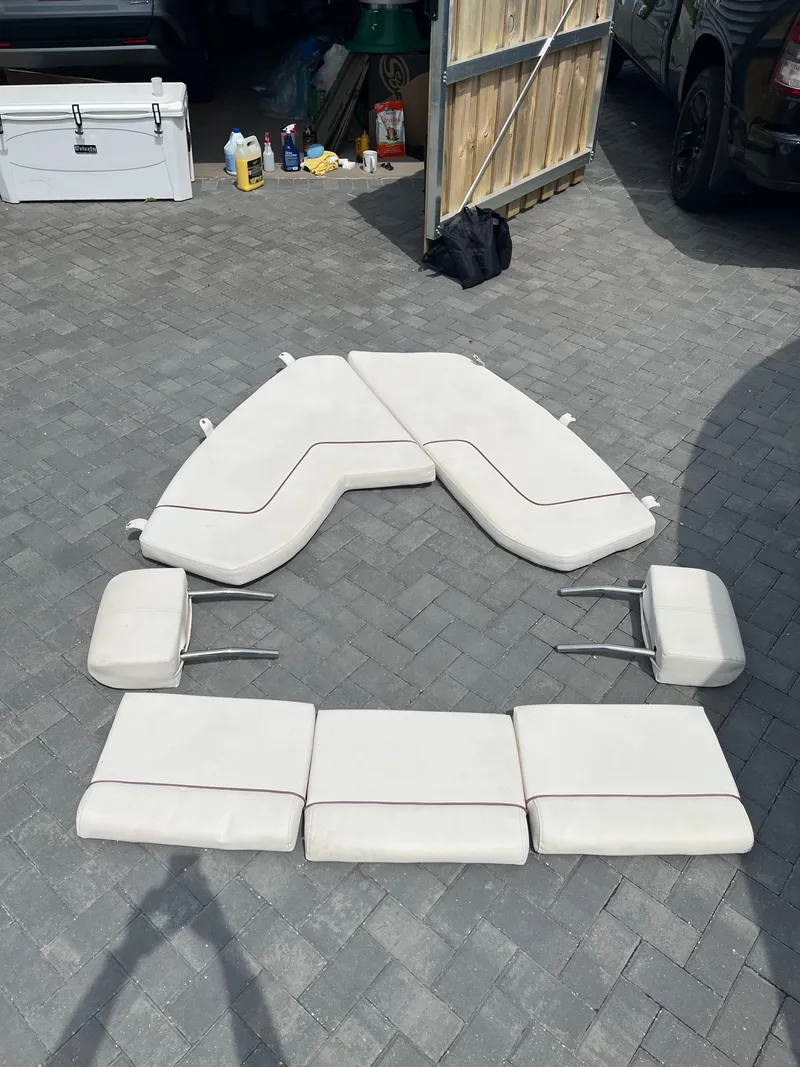 Slide: The Image of Boat cushions for 2019 Sea Hunt 235 SE arranged on a paved surface. - 5