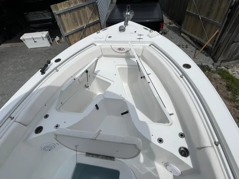 Slide: The Image of 2019 Sea Hunt 235 SE boat interior with open storage compartments and sleek design. - 8