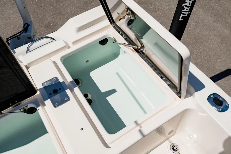 Slide: The Image of Open storage compartment on a 2015 Edgewater 240 Inshore boat. - 10